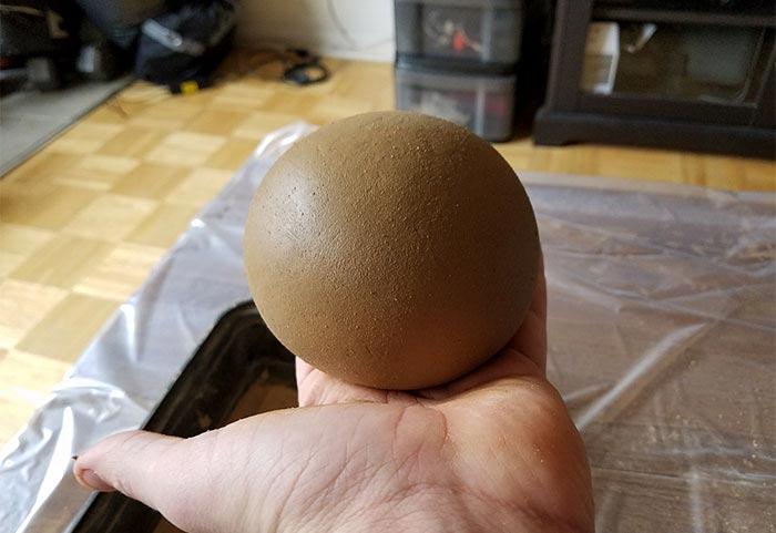 Японцы полируют грязевые шарики, японцы полируют шары из грязи